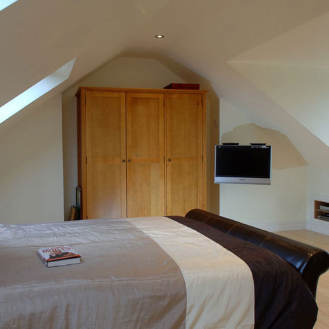 Loft conversion bedroom with velux windows